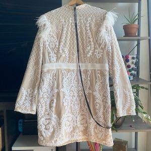 White sequin feather shoulder detail bodycon dress